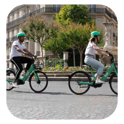 two people riding ebikes