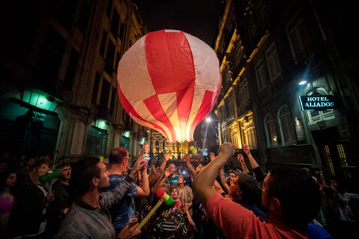 people surrounding a baloon